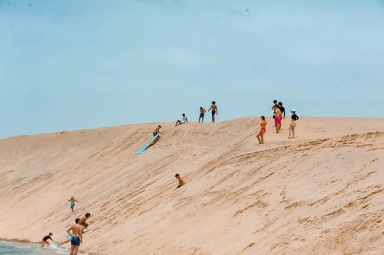 View over Dakhla lagoon with kites in the sky and calm water